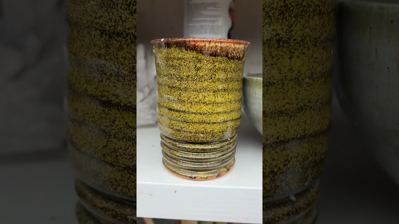 Glazing pots in my pottery studio for an April 11-12 sale at Freeland Art Studio. 