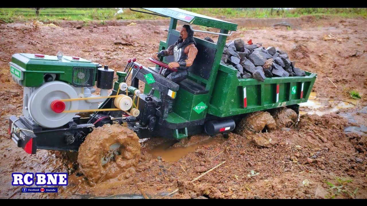 RC BNE _ The driver carries the block of stone.  stuck on a rutted road