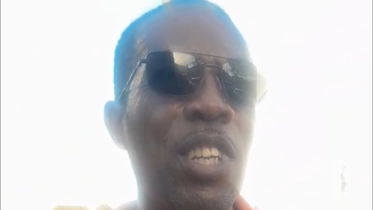 Roger Bourne of the Seventh-Day Adventist Church talks of parade - Pathfinders Band - Barbados