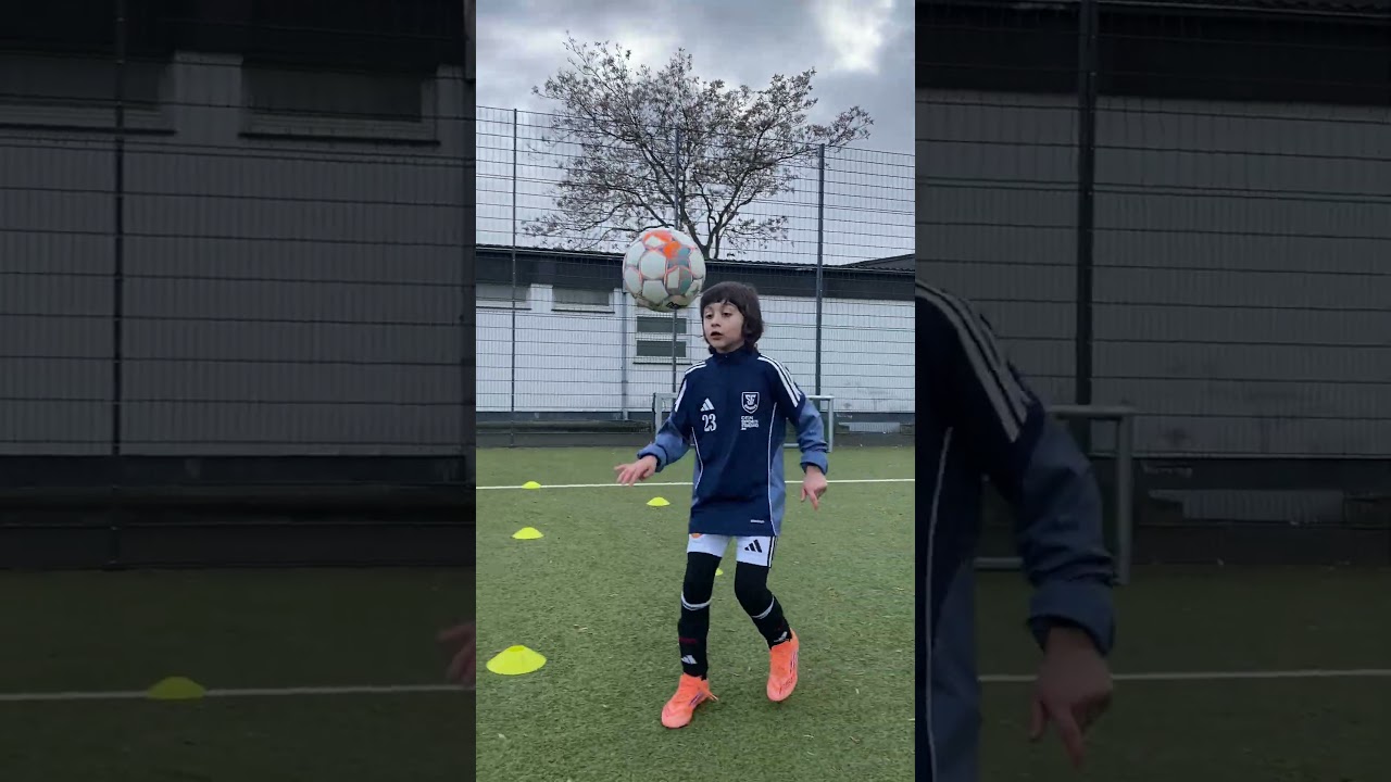 Juggling the ball in a flowing figure-eight zigzag motion 