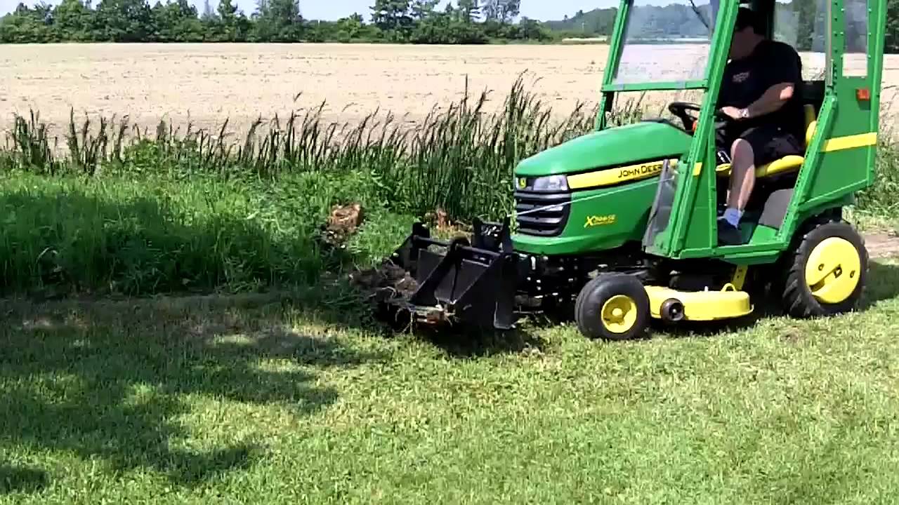 John Deere X300 & 40 inch Tractor Shovel