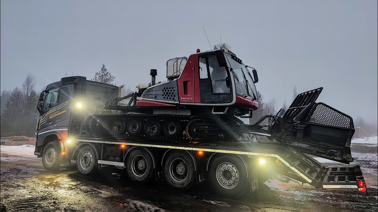 Snowfall, starting a snow groomer, moving machine