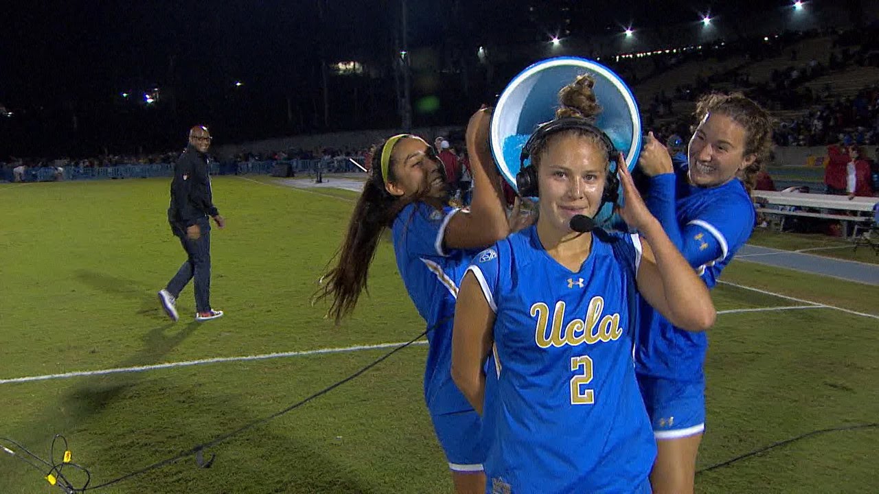 UCLA's Ashley Sanchez gets dunked after game-winning goal against USC in OT