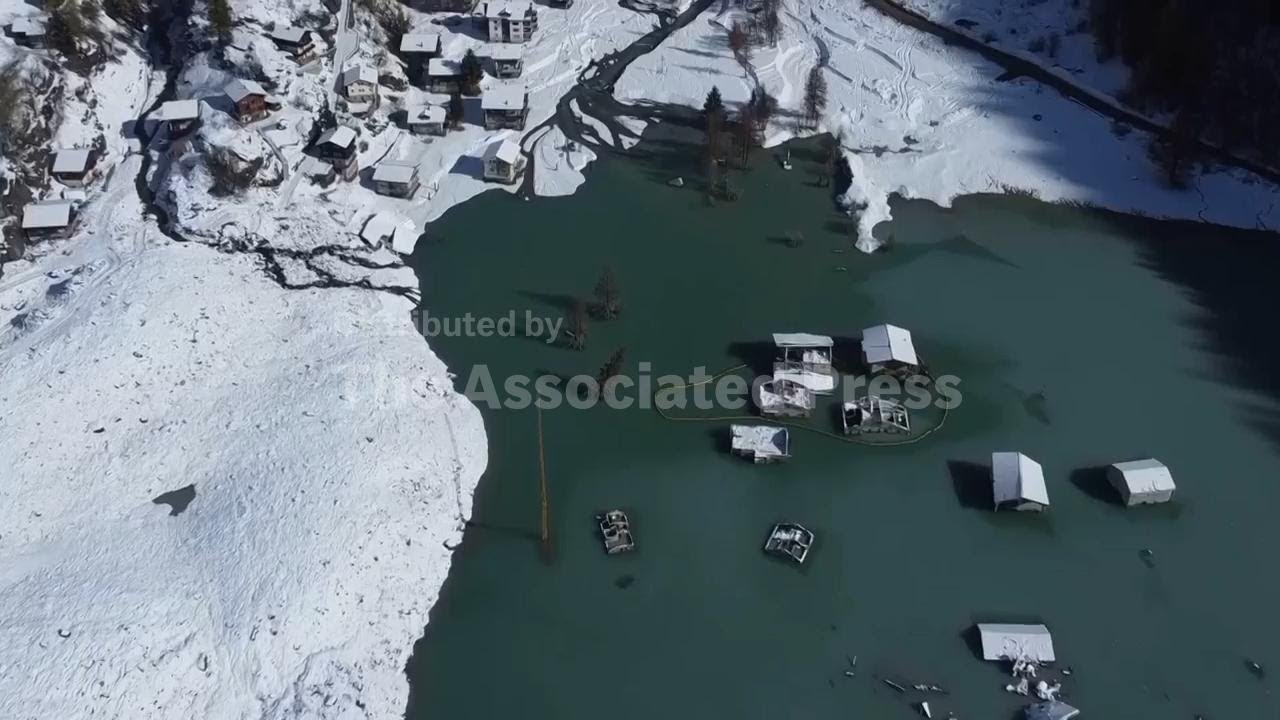 Hotelier rebuilds after devastating landslide all but swallowed up Swiss village