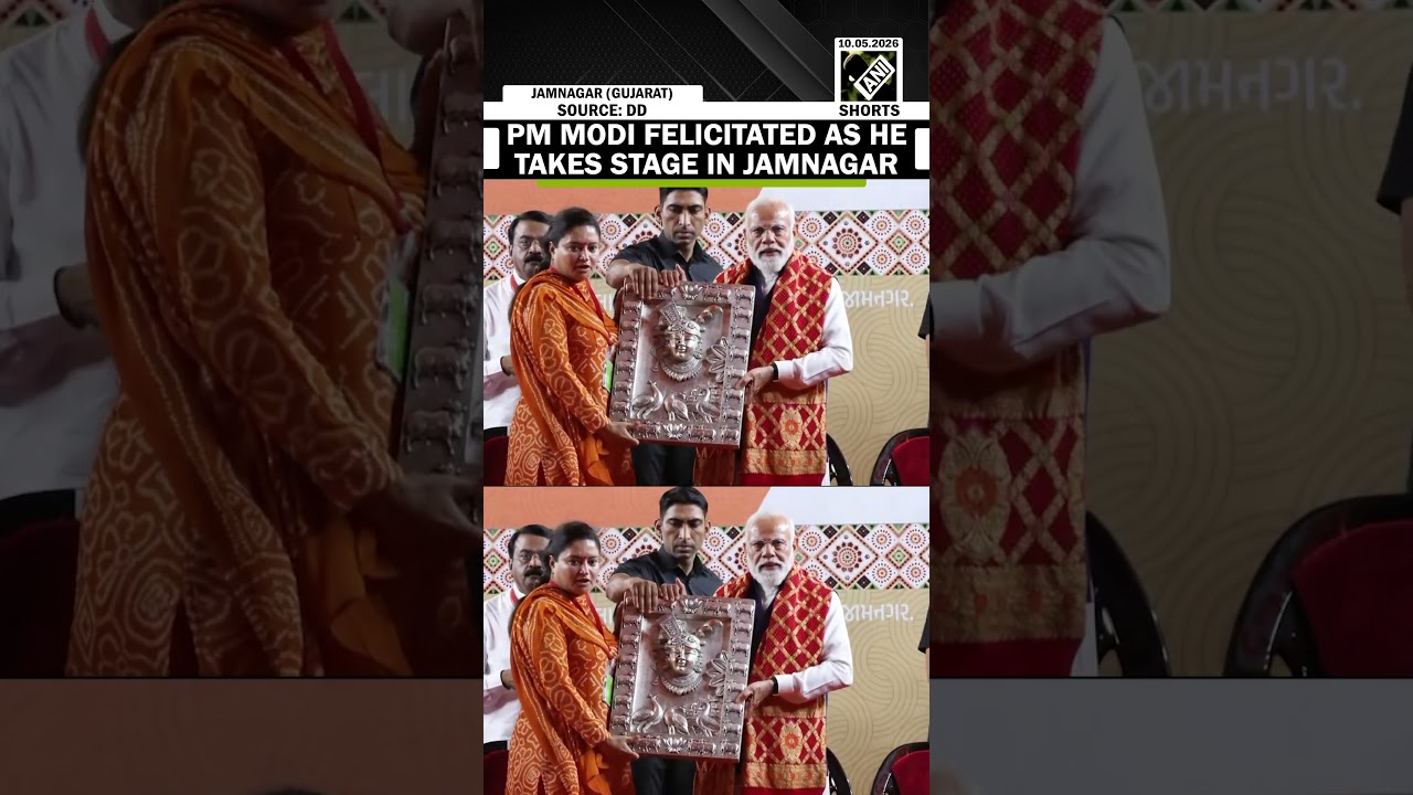 PM Narendra Modi felicitated as he takes the stage at a public rally in Jamnagar