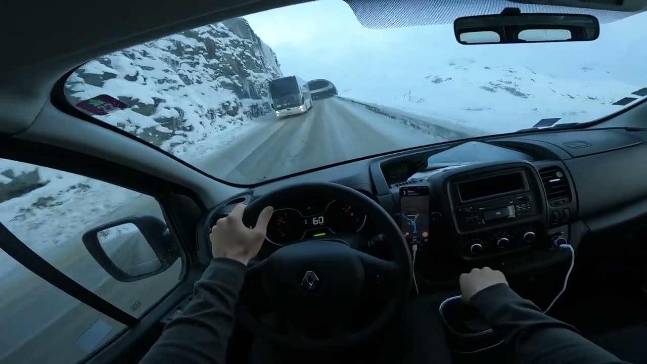 Driving to Val Thorens. Snow on the road. French alps. Renault Traffic driving cockpit POV