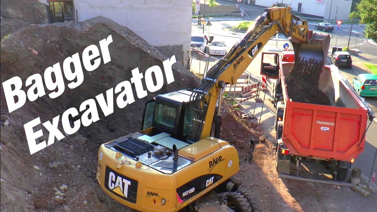 BAGGERN mit dem Mobilbagger M318D Caterpillar Blick von oben - wheeled excavator earthworks