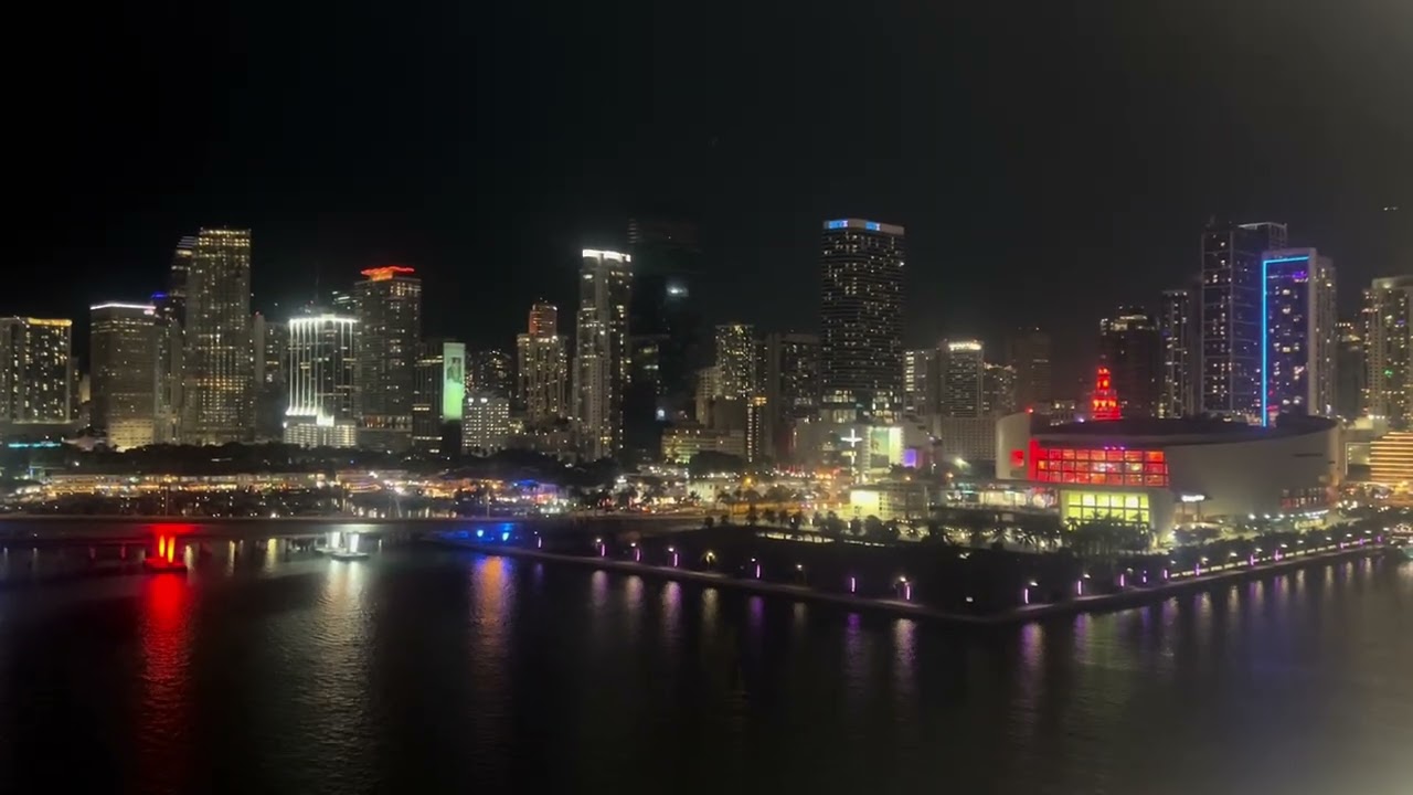 Sail away from Miami cruise terminal. Miami in night with lights