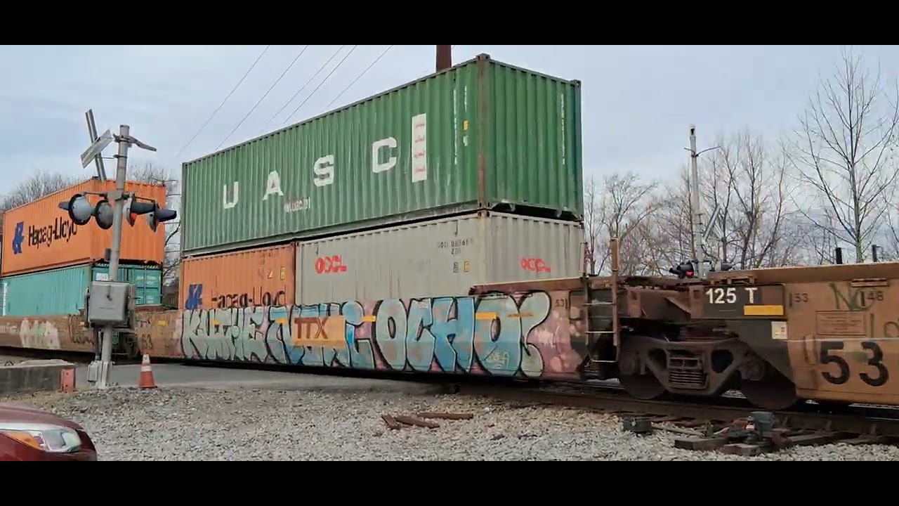 NS container train crosses shell road