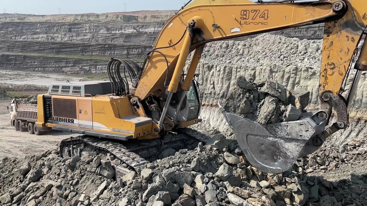 Liebherr 974 Excavator Loading Mercedes And MAN Trucks