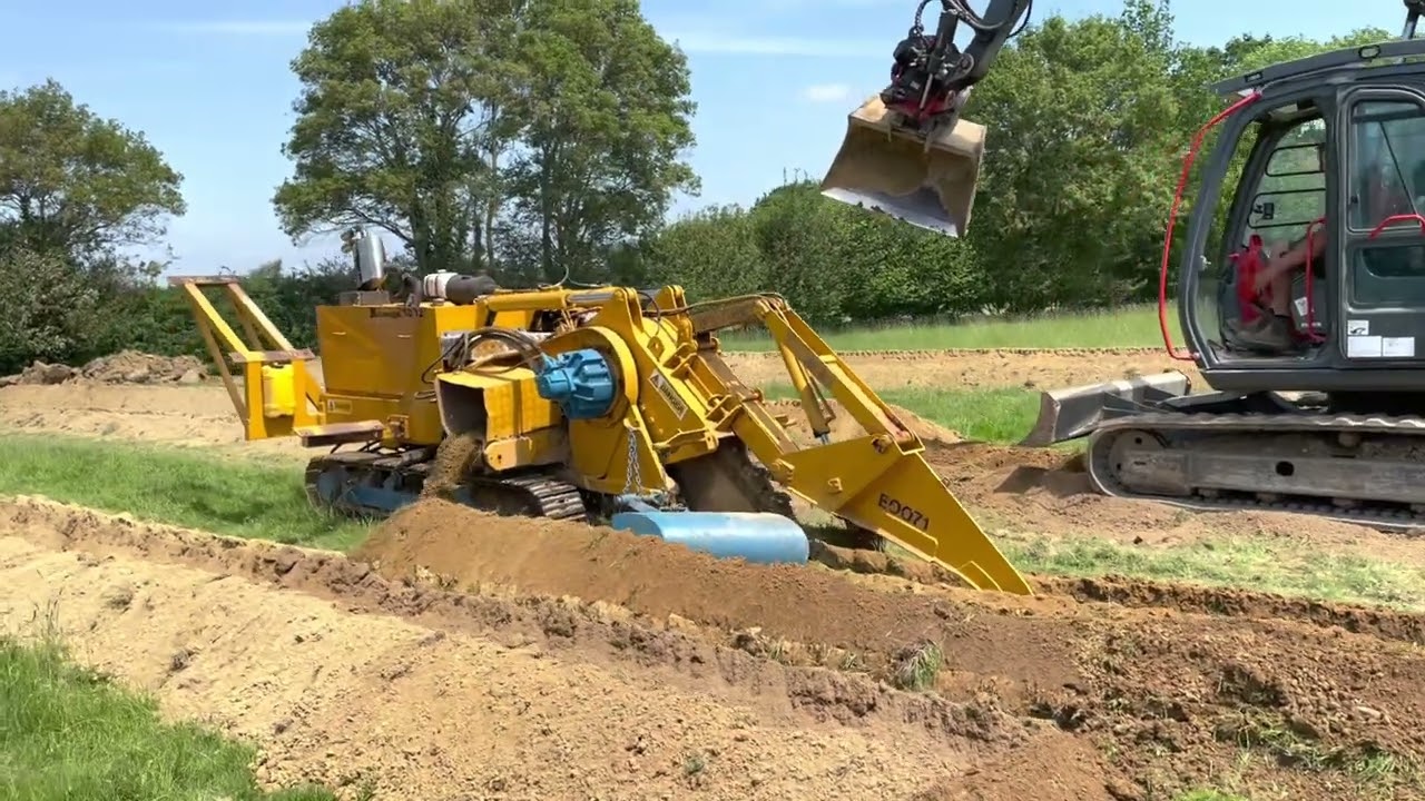 Ground Source Heat Pump Ground Loops with Trenching Machine