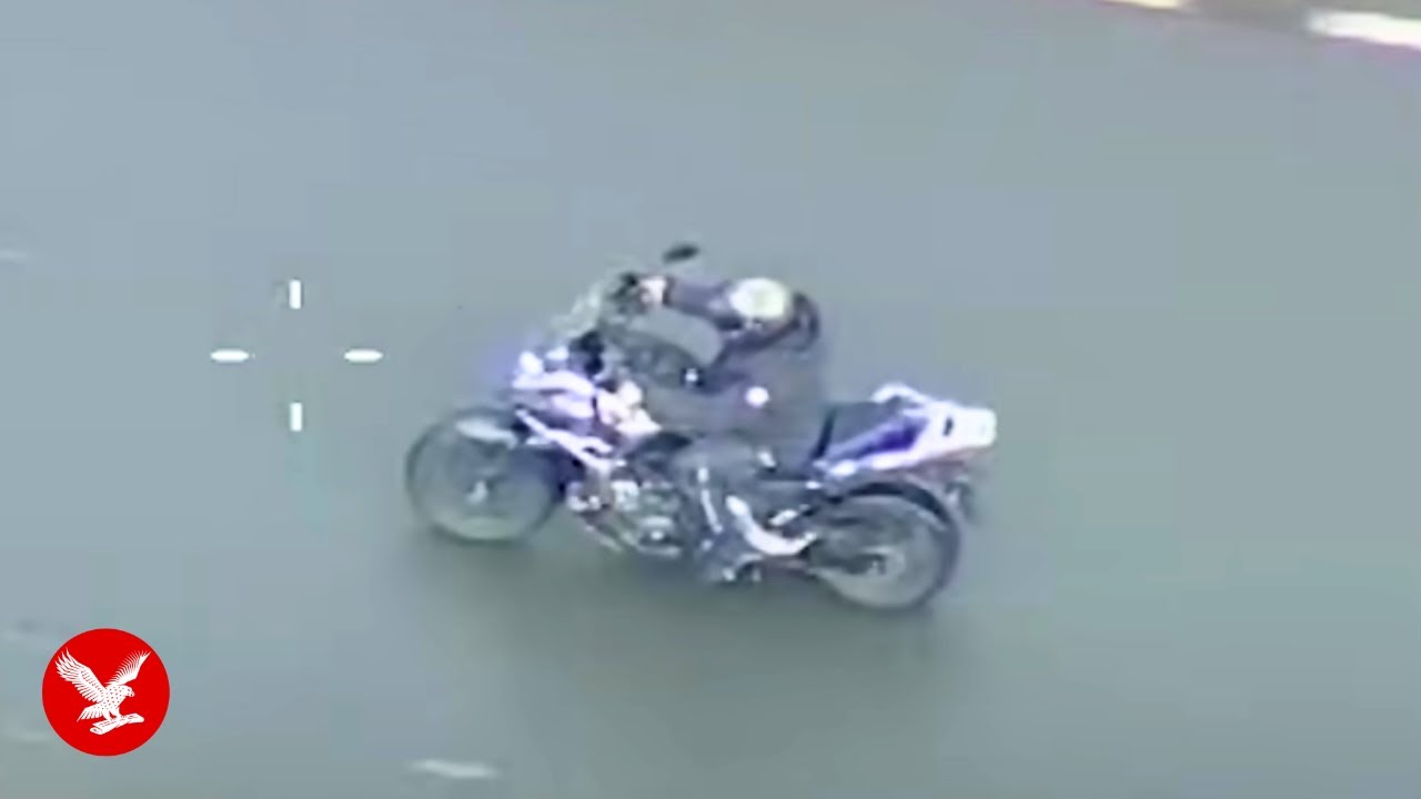Armed police takedown motorcyclist with tactical contact
