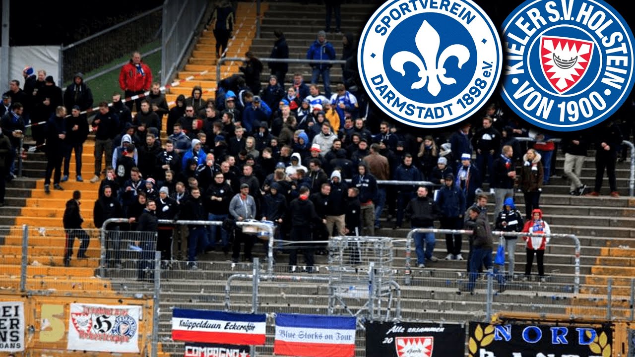 Wie Darmstadt zwei Kiel-Zaunfahnen im Stadion zog...