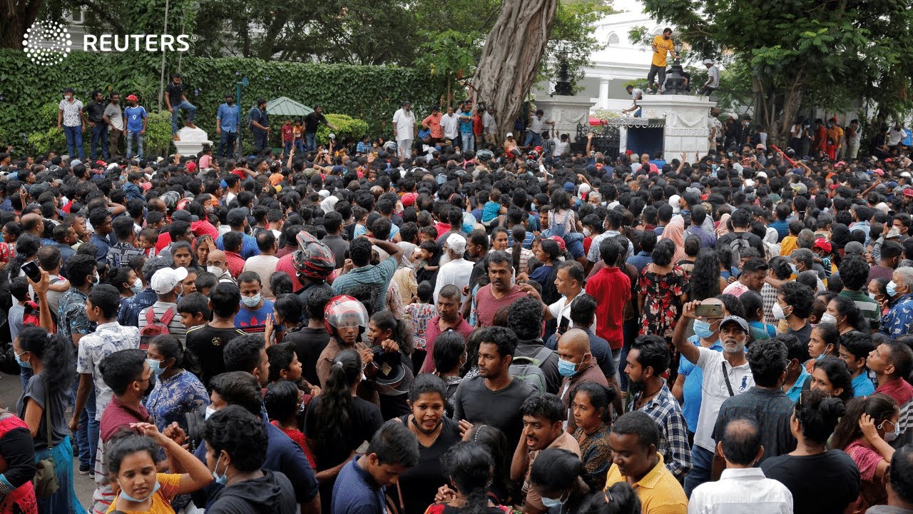 Sri Lankans throng ransacked presidential palace