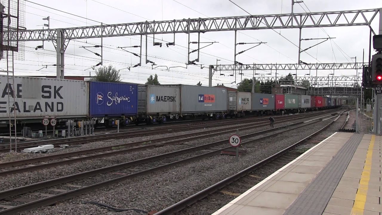 Freightliner Class 90 041 heads a southbound intermodal through Stafford Station
