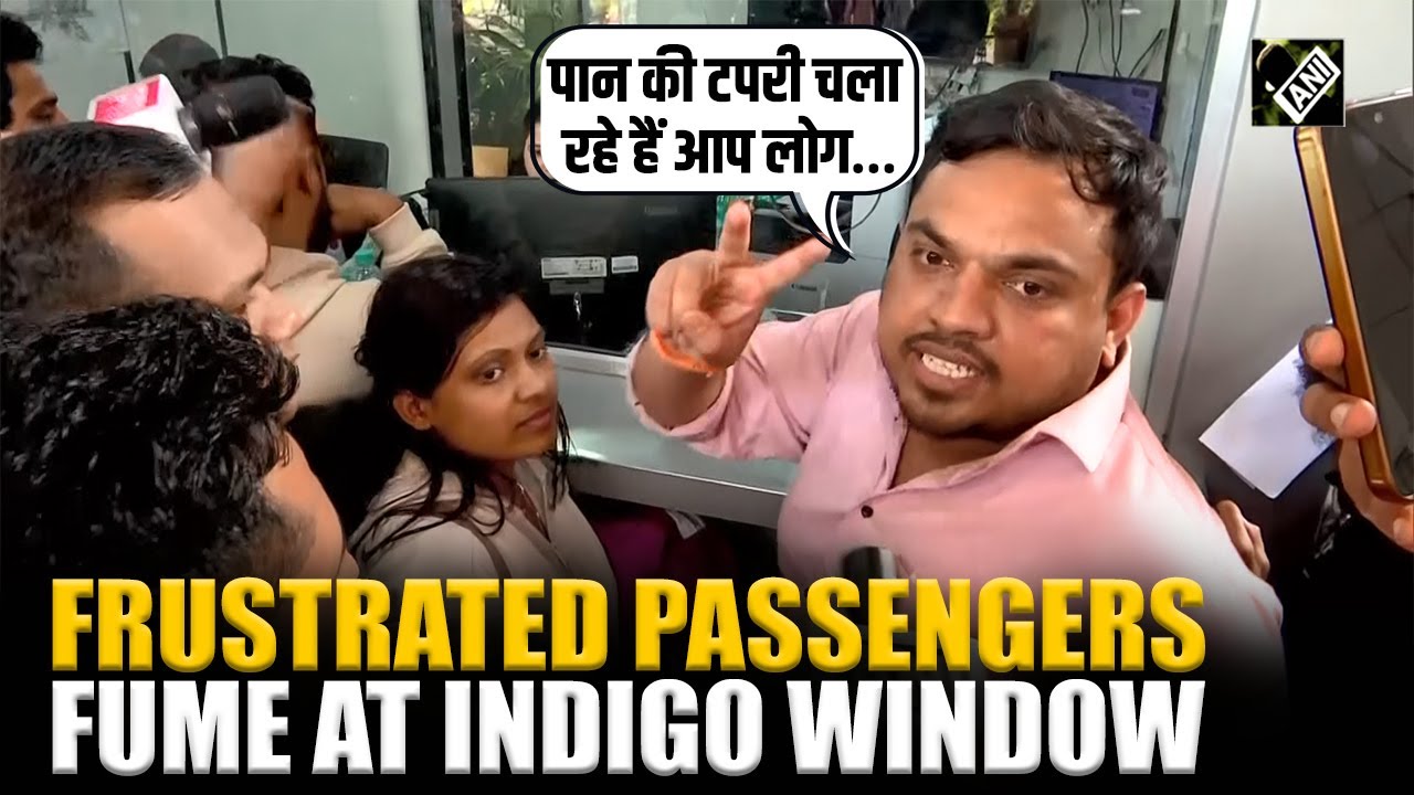 Frustrated passengers fume at IndiGo airline window after repeated flights delays, cancellations