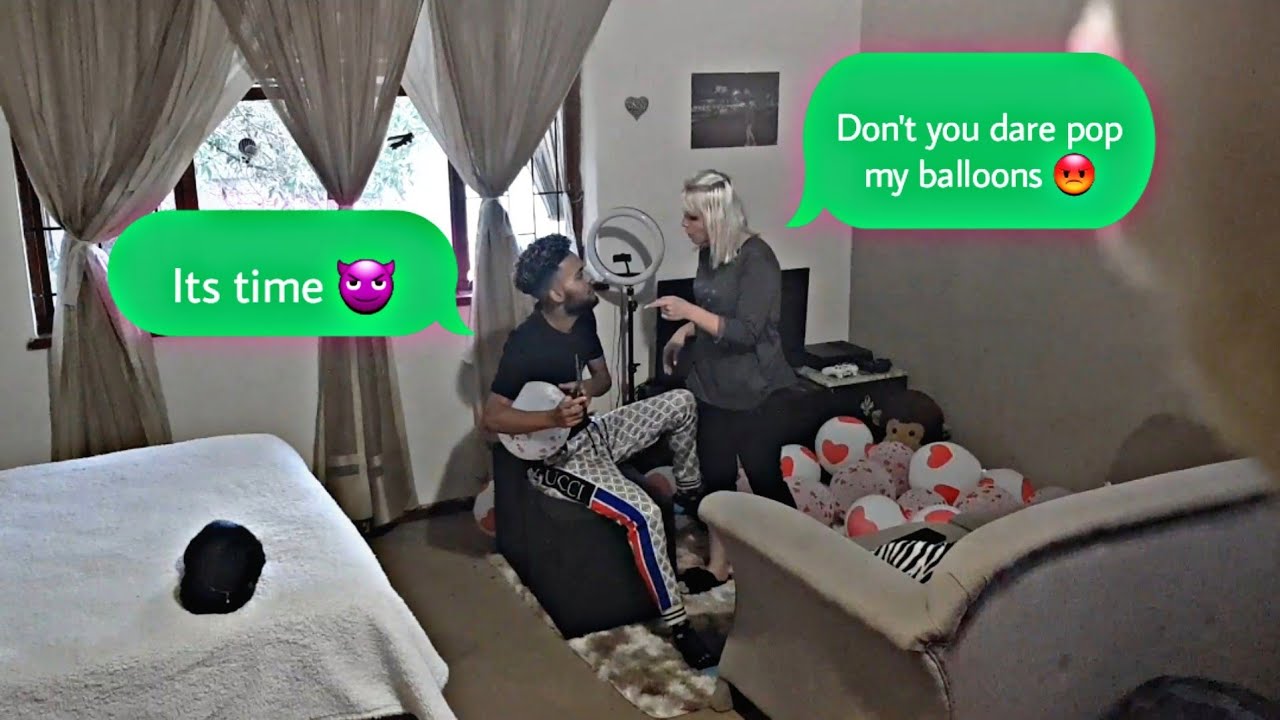 popping my girlfriends balloons to see her reaction
