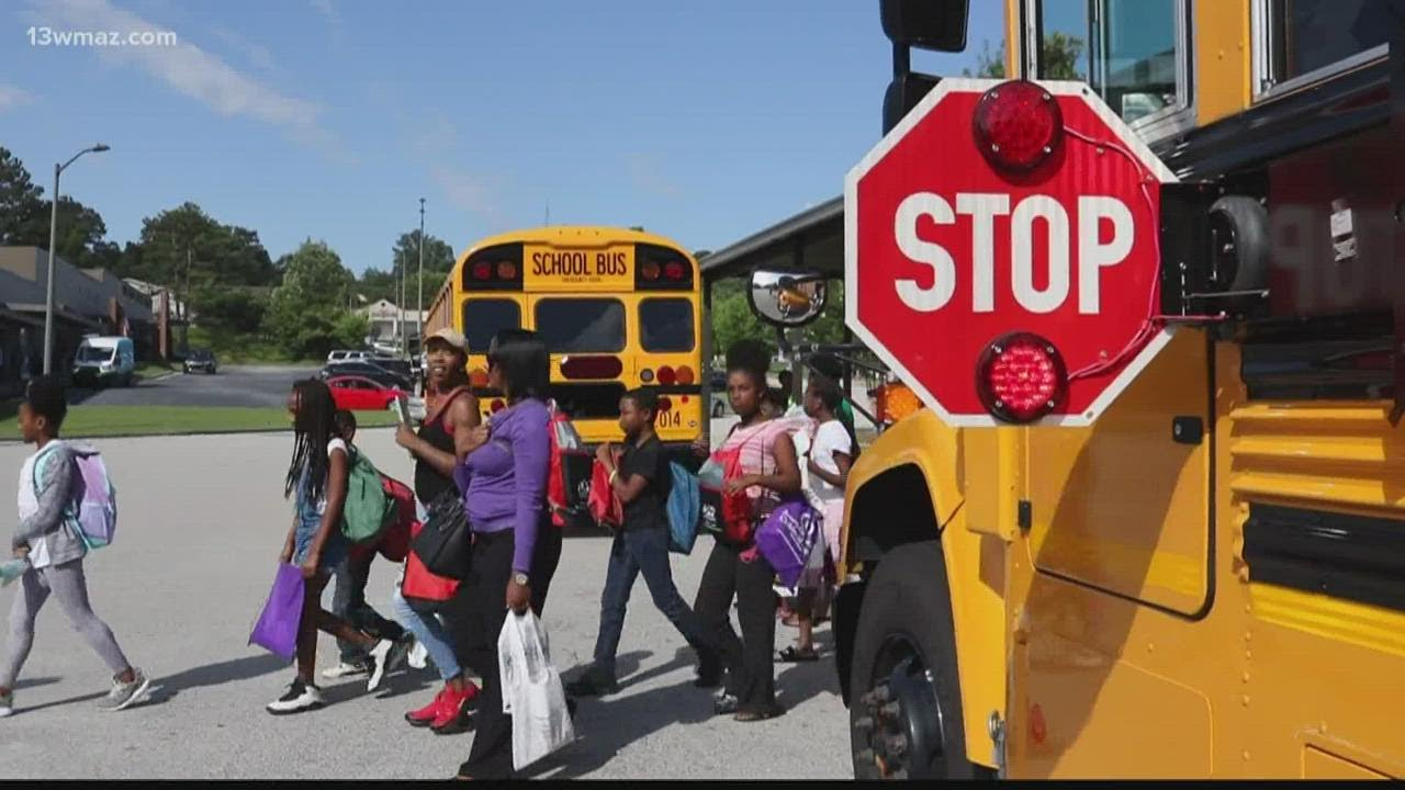 No, you don't have to stop for a school bus on a highway divided by a median