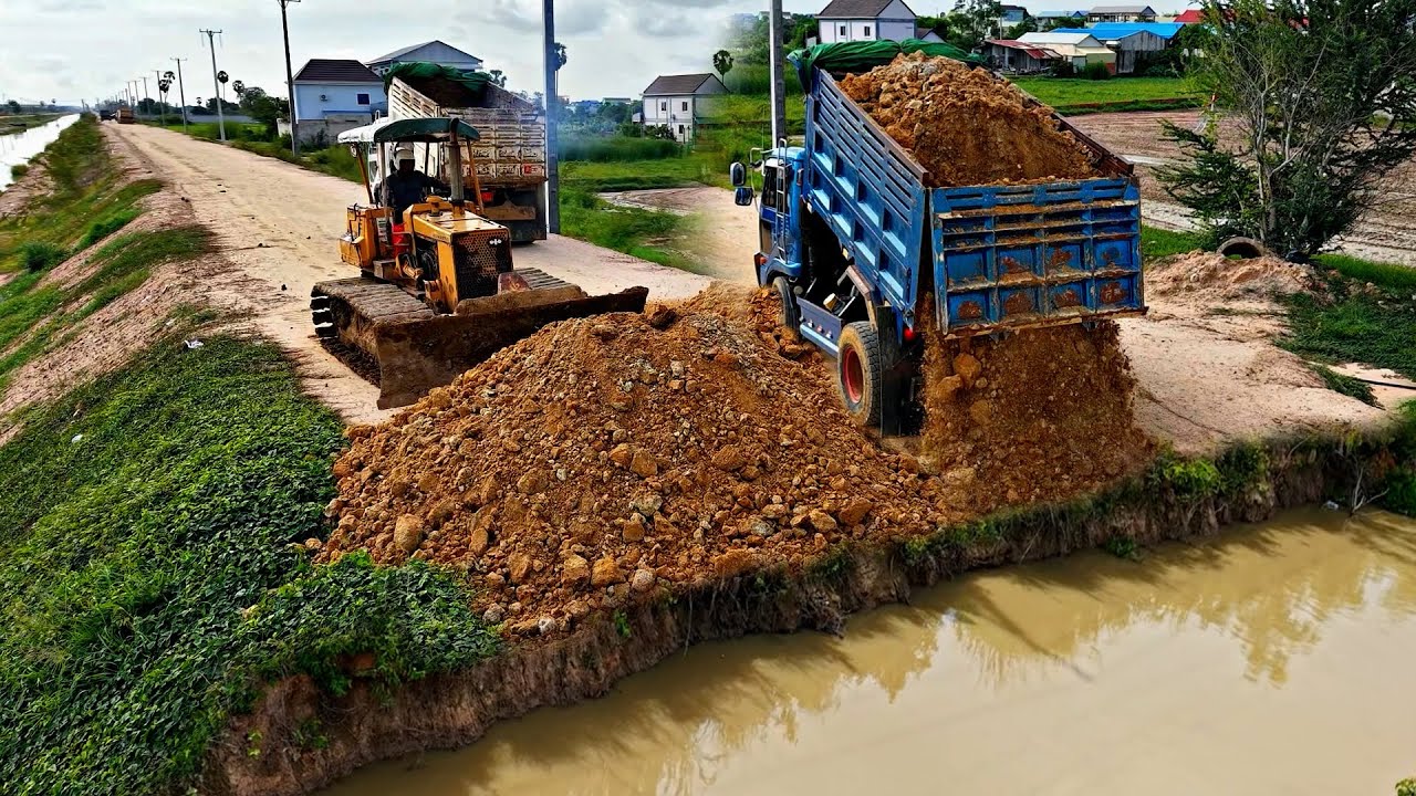 Powerful Dozer Komatsu D31P Pushing Soil Repair The Road With 5T Truck