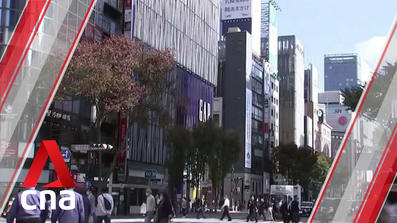 Tokyo raises coronavirus alert to highest level as new cases break record