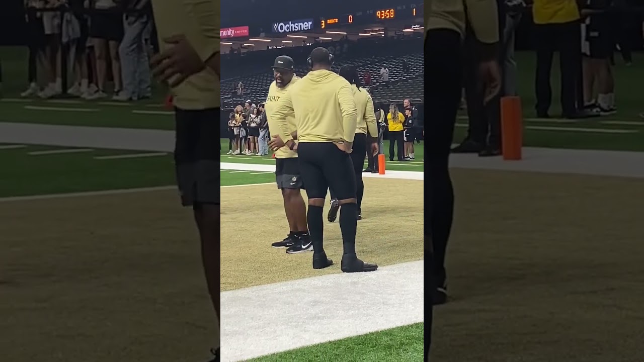 Saints legend working with first round pick, left tackle Kelvin Banks Jr. before the game.