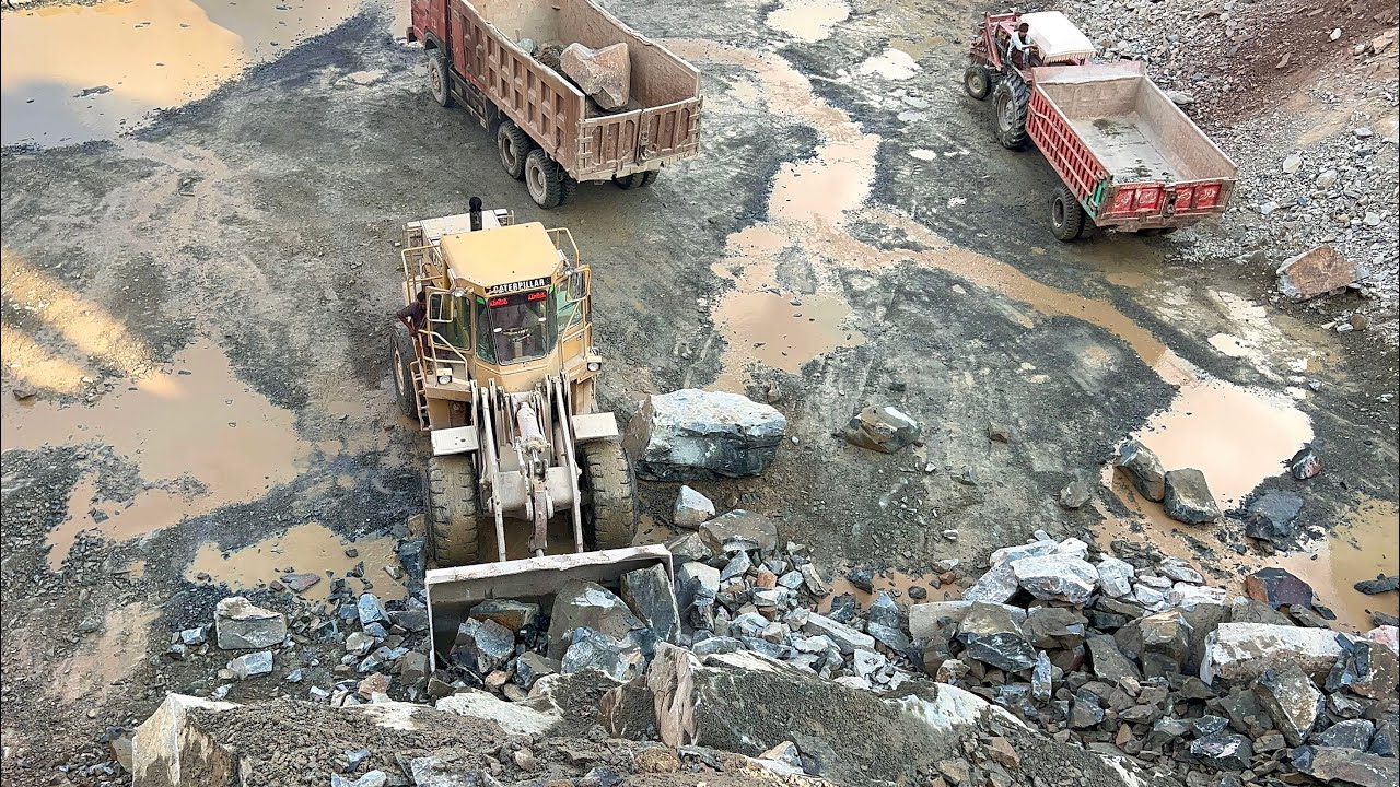 Heavy Equipment Loading Gaint Rocks Like a Beast | Caterpillar in Action : powerfull loading process