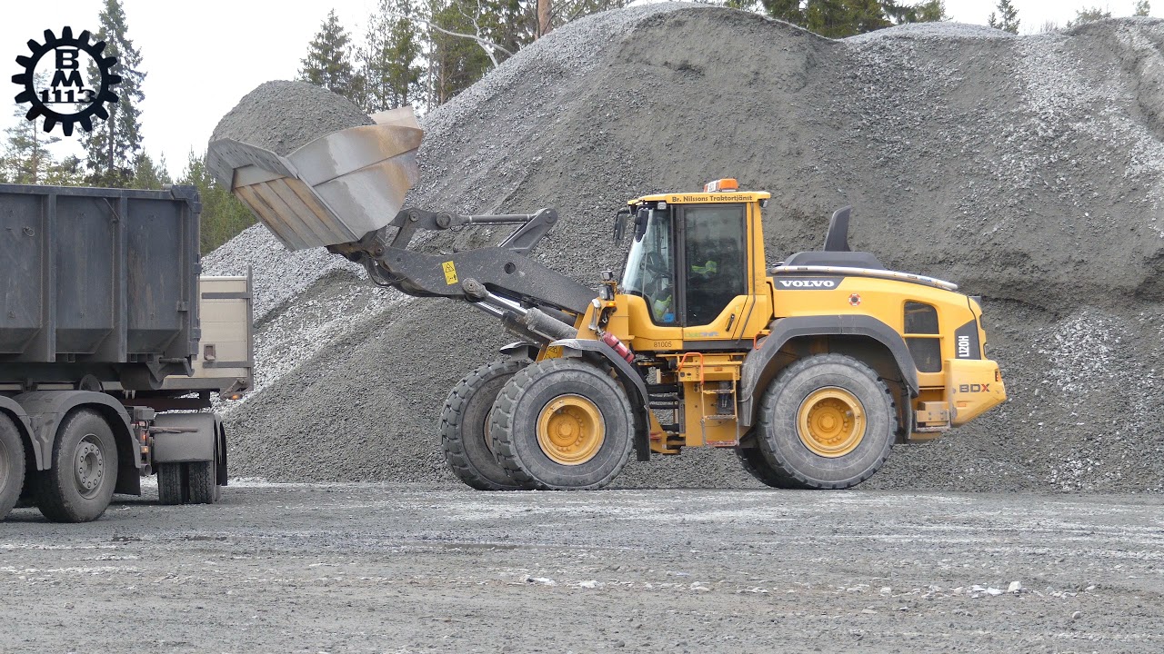 Volvo L120H loading gravel on Volvo , Scania trucks