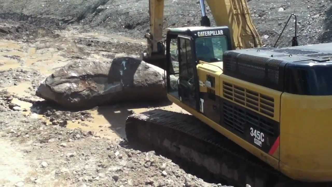 Cat 345C having boulder trouble