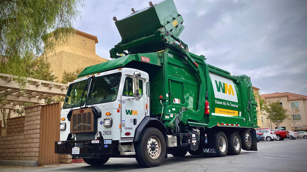 Waste Management Peterbilt 520 Heil Half/Pack CNrG Front Loader Garbage Truck