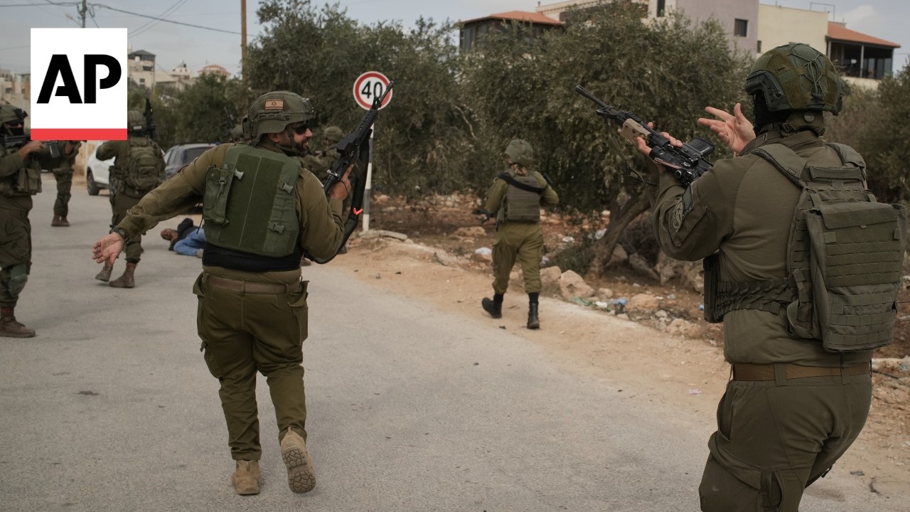 Israeli settlers attack West Bank olive harvesters and set vehicles on fire