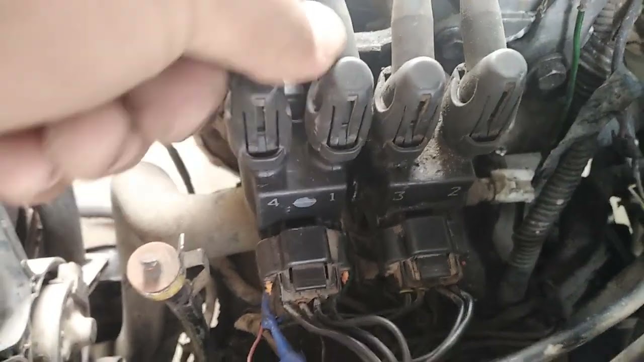 Auto station wagon Toyota Corolla año 1999  Motor 5E : Posicion Cable Bujia