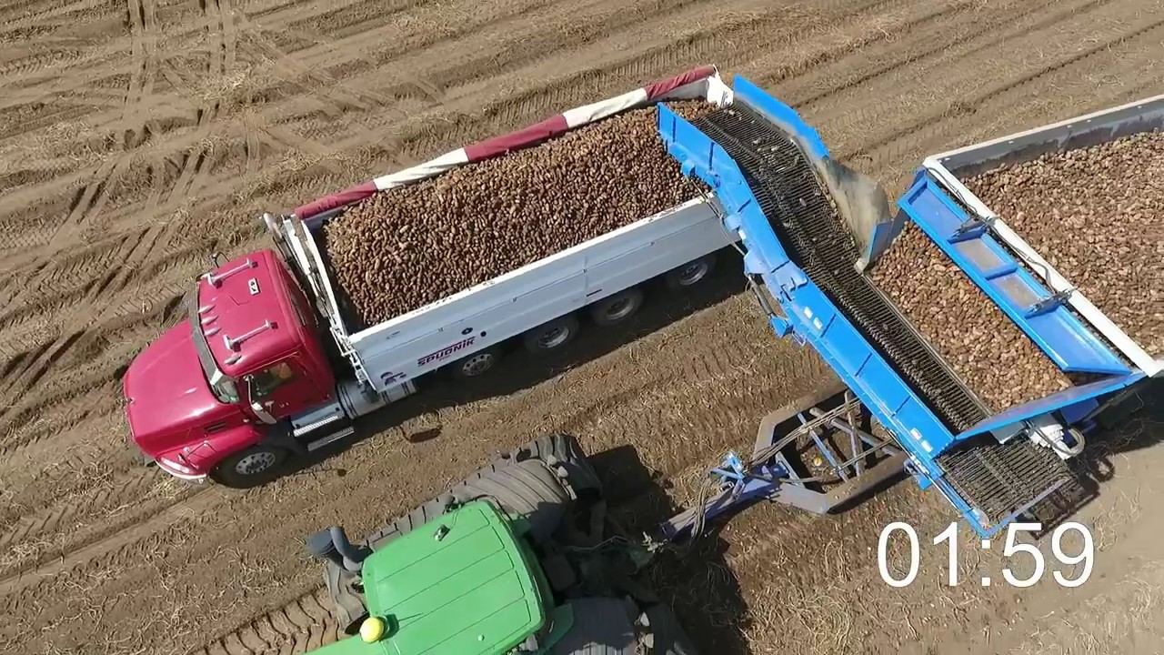 Crop Shuttle loading a potato truck with timer