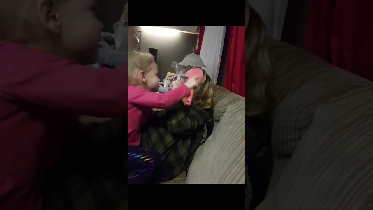 Brushing moms hair. It doesn't hurt.