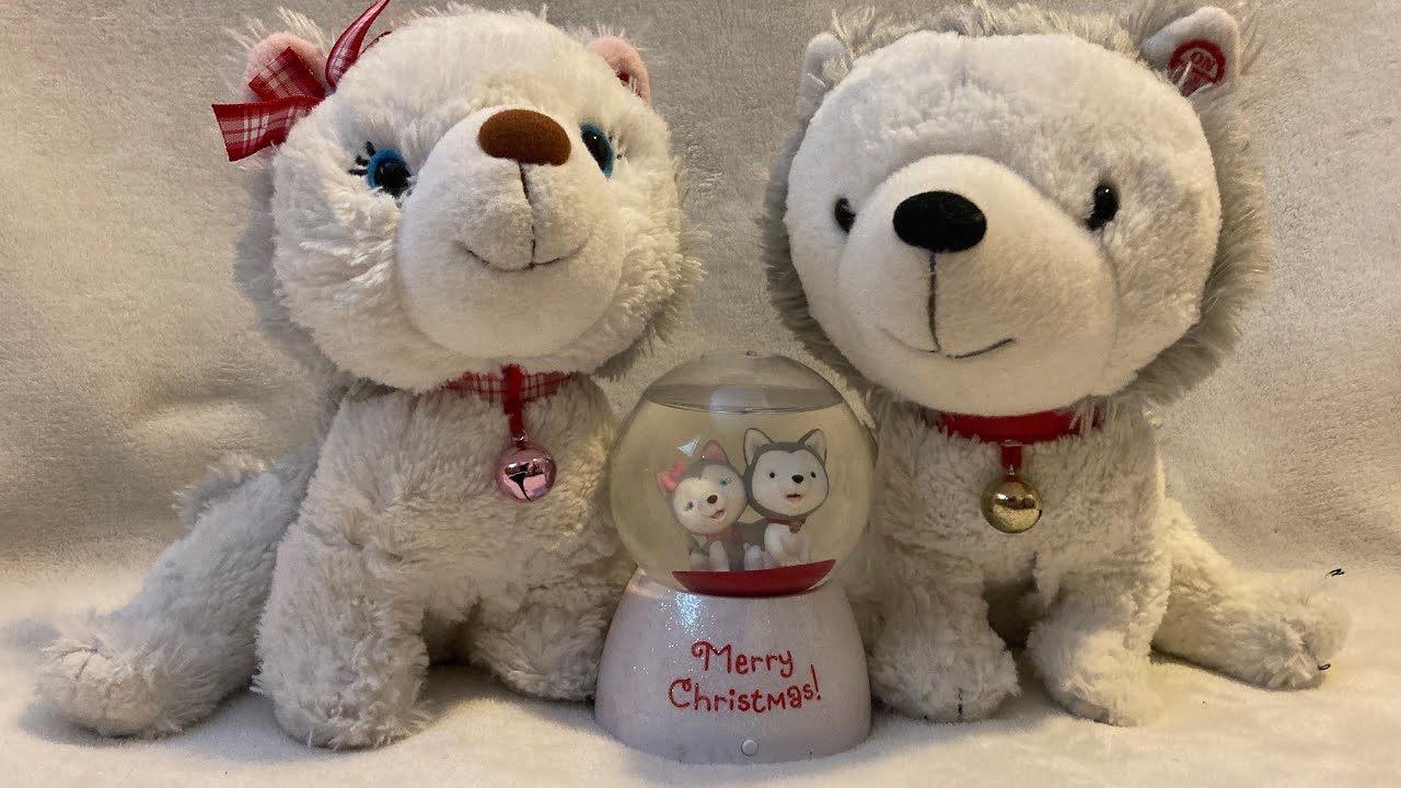 Hallmark Jingle and Bell husky pups sing to their Christmas snow globe!!