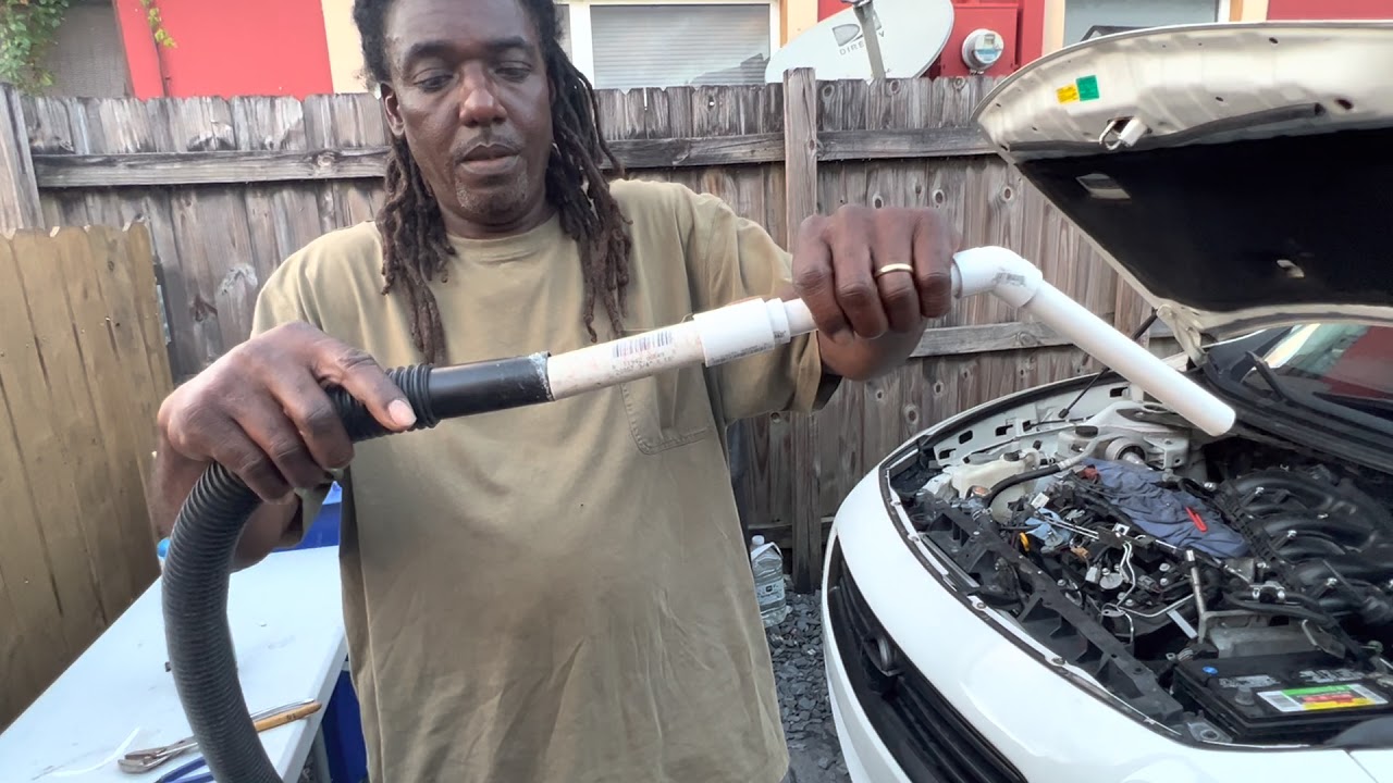 Removal of debris from spark plug hole