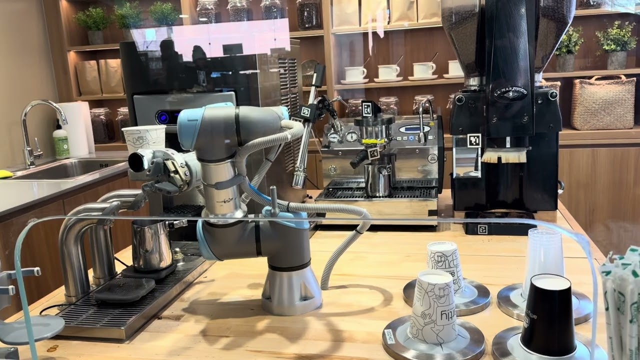 The robots are taking our jobs! Coffee robot at Muji in Harvard Square 