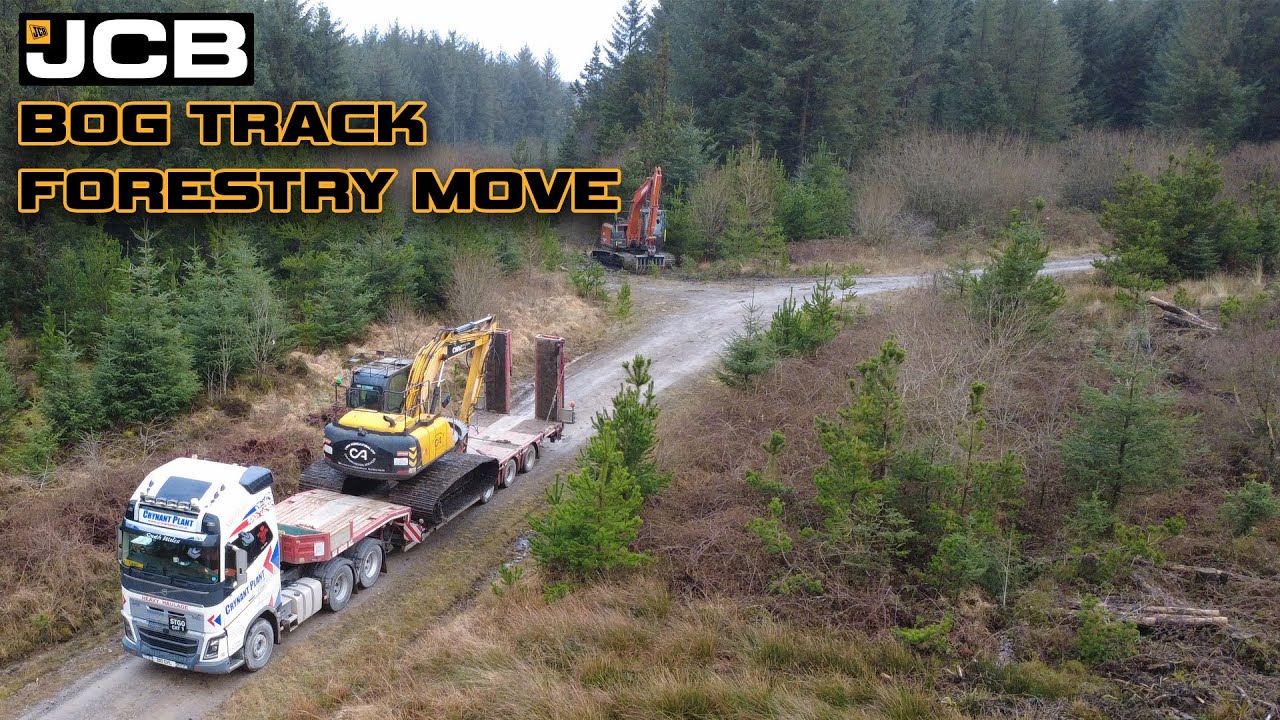 Перемещение лесозаготовочной техники JCB по болотистой местности - долины Уэльса