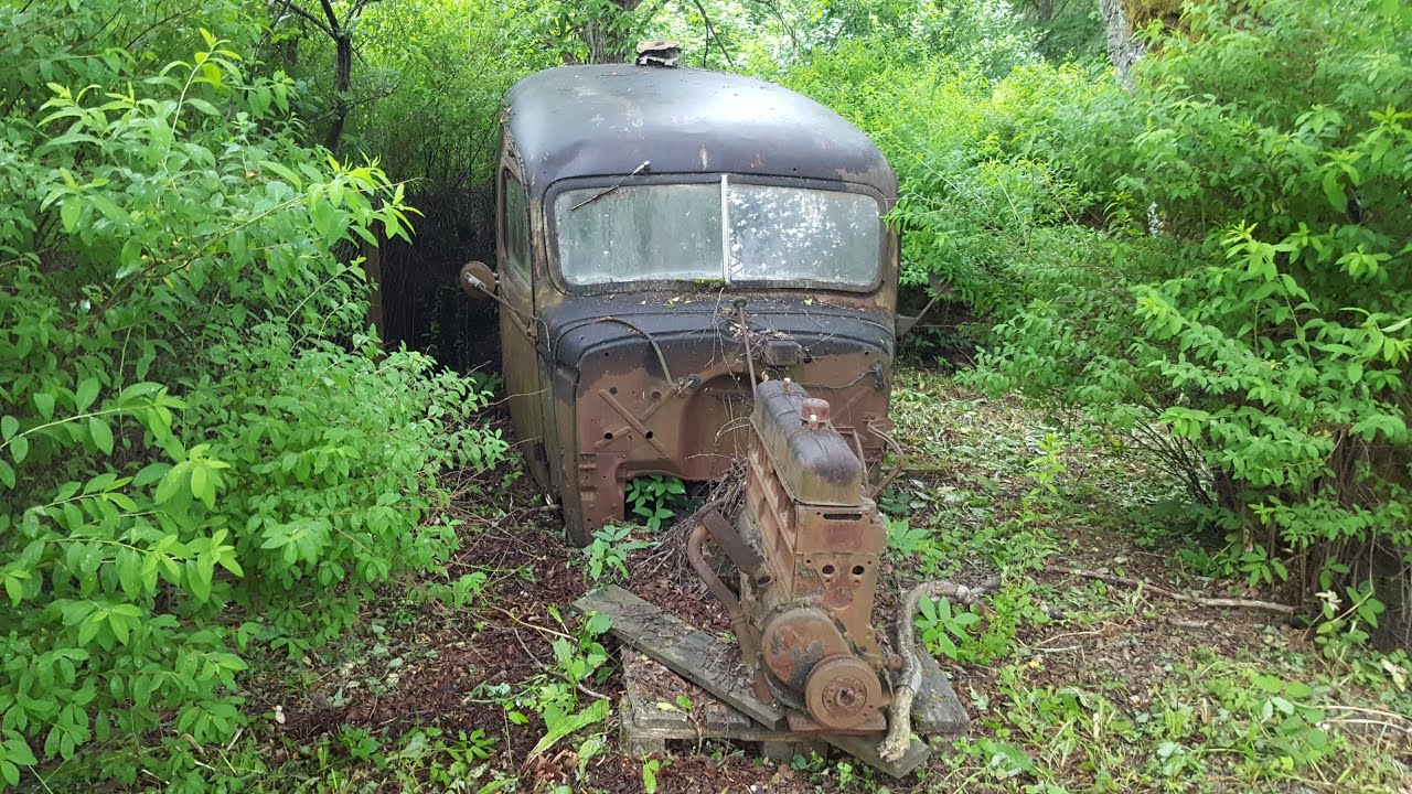 Abandoned Cars and Heavy Equipment In the woods