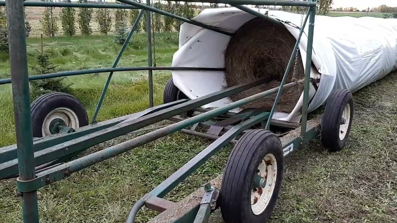 John Deere 3010 Tractor uses Tube-O-Lator!  #bale #JohnDeere #tractor #tubeolator