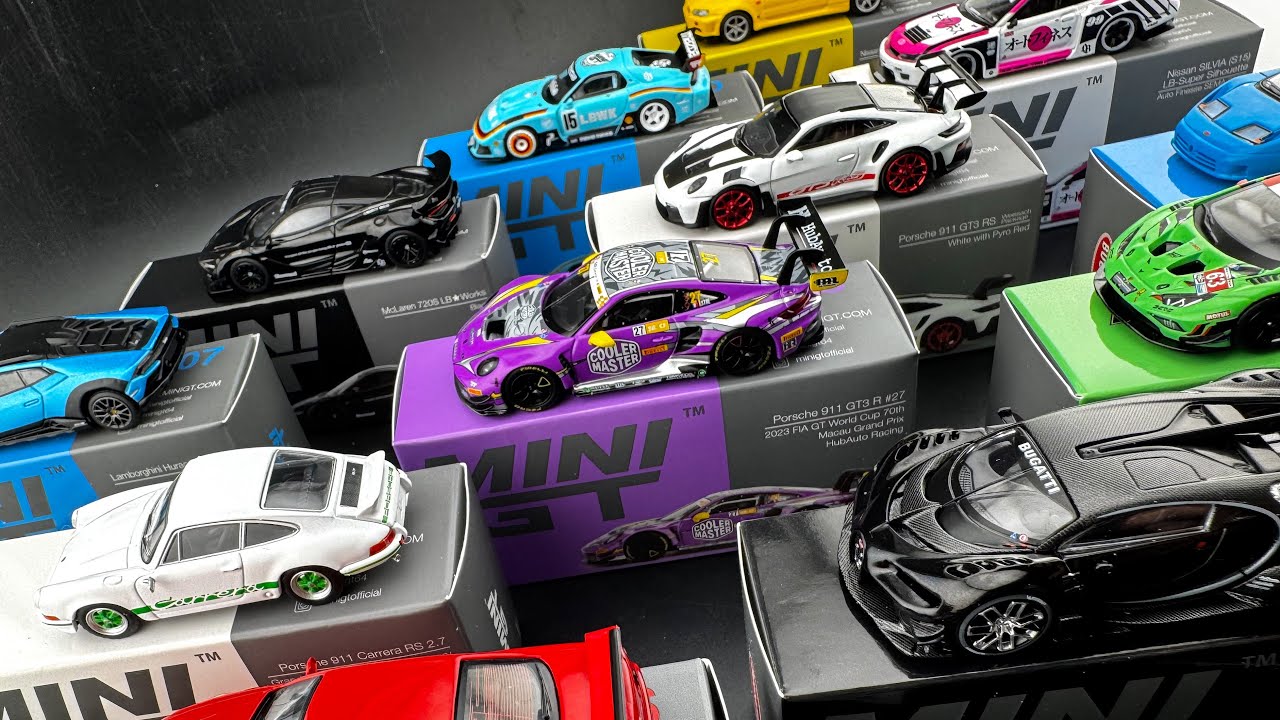Nerding out while opening a STACK of brand new MINI GT