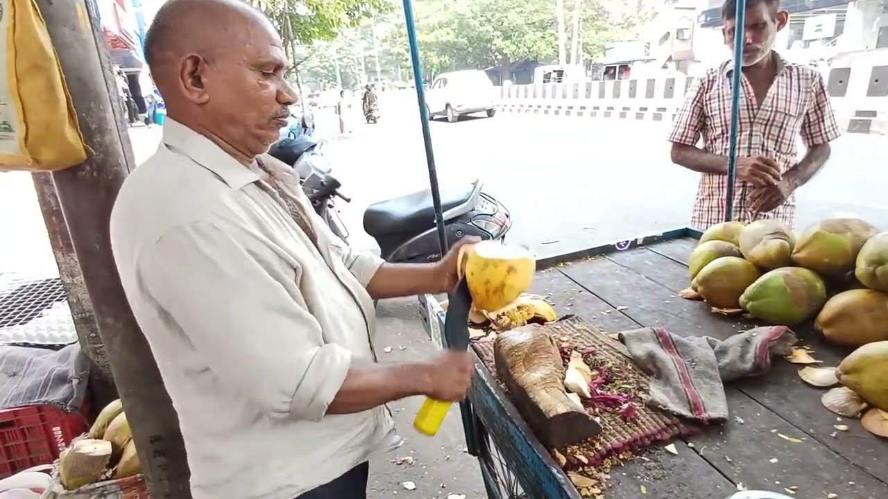 Hard Working Man Selling Very Tasty Coconut.