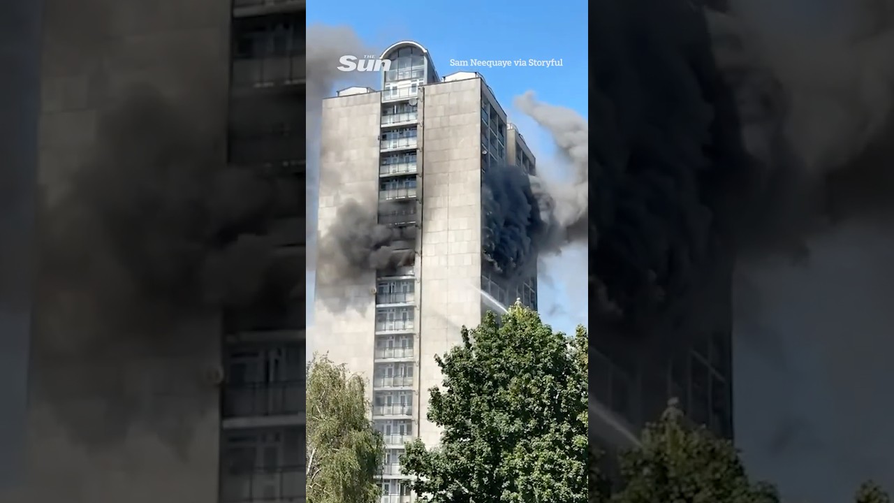 Fire breaks out at 17 storey towerblock with huge cloud of smoke filling sky