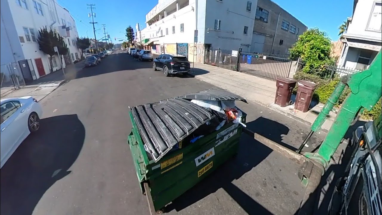 Waste Management commercial front load garbage truck 