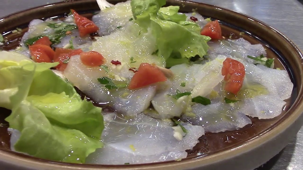 Carpaccio di baccalà, bocconcini di baccalà, risotto al caciolimone, rotolo di panettone