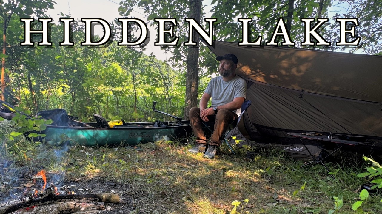I found a HIDDEN LAKE deep in the forest | Solo Canoe Camping
