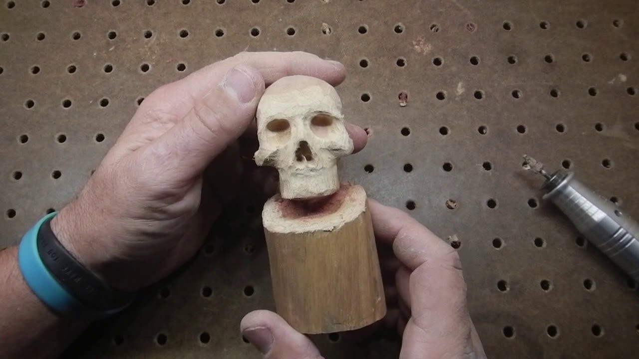 Wooden Skull with Red Jaw power carving.