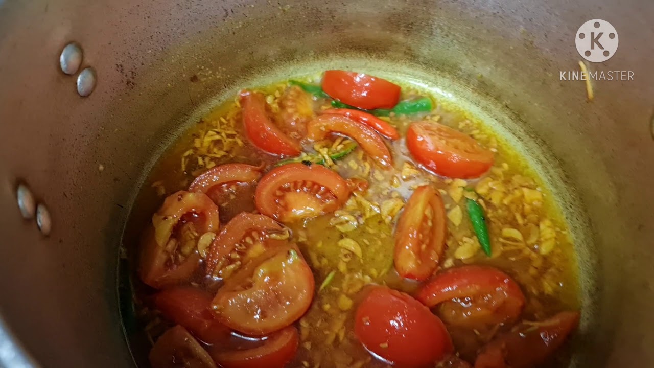 Making tomato tenga curry with Fish