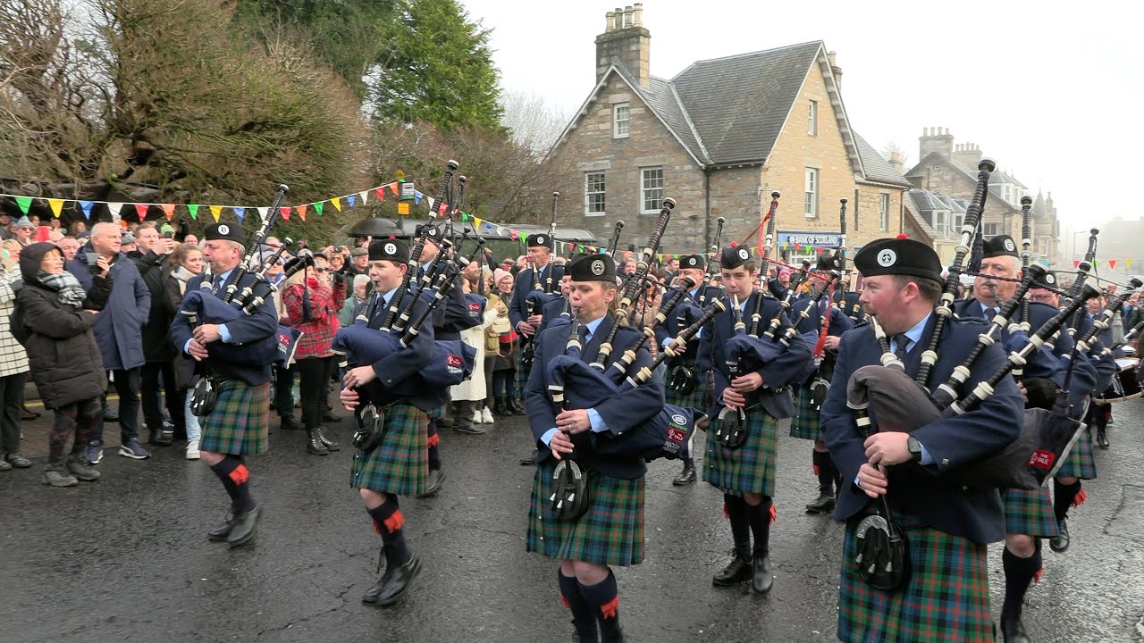Scotland the Brave as Vale of Atholl Pipe Band march off during Pitlochry New Year 2024 Street Party