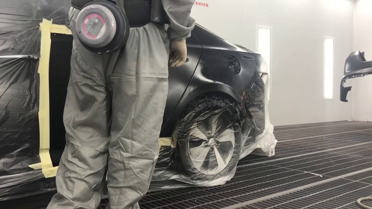 Spraying black metallic Kia Optima with Lesonal Waterborne