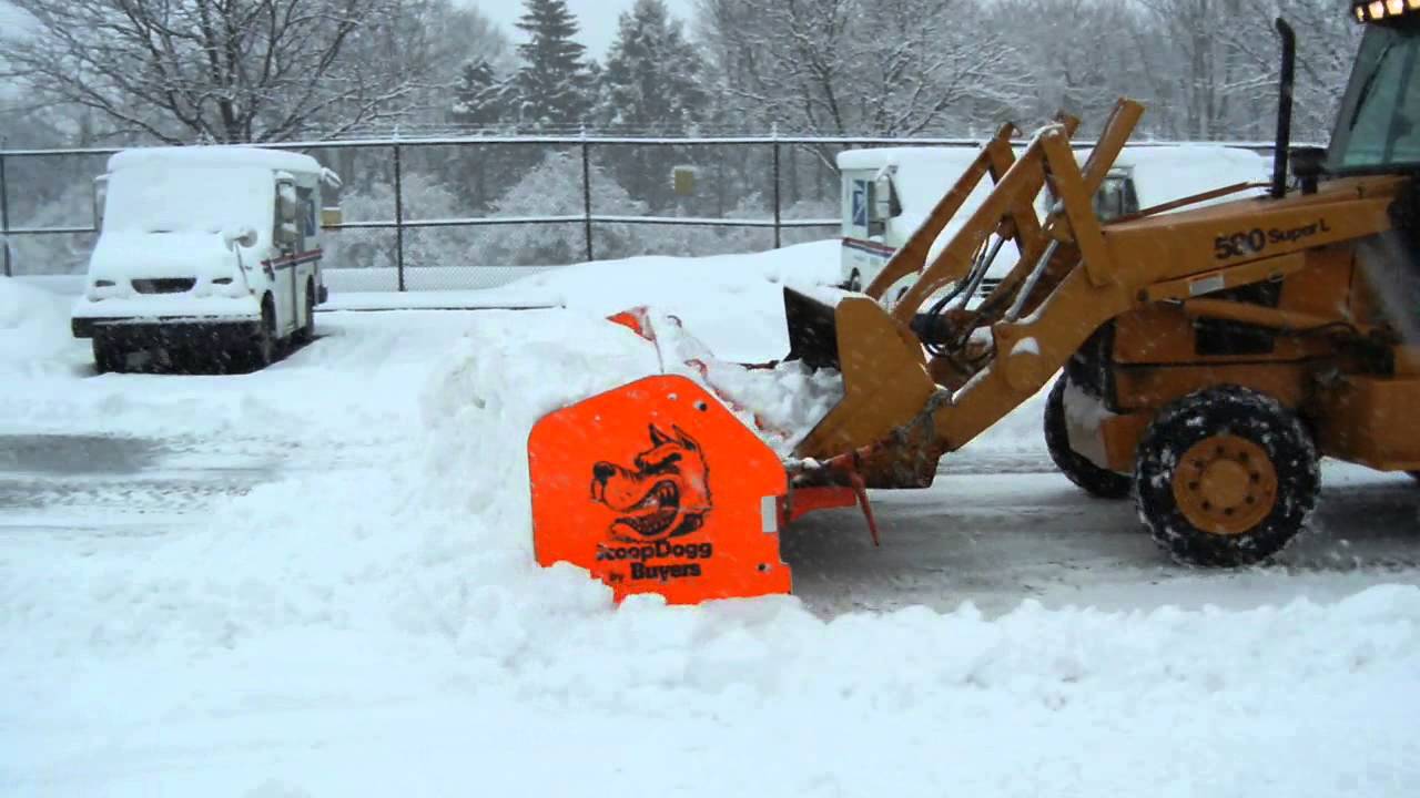 580SL Backhoe Pushing snow Snow Pusher